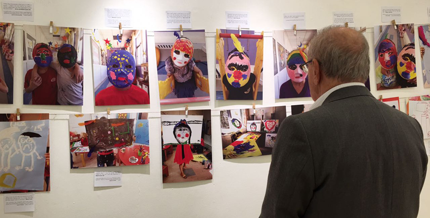 A visitor checks artwork on display at Foresight Gallery in Amman on Sunday (Photo by Muath Freij)